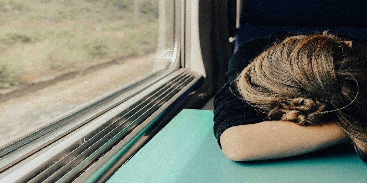 Person resting from fatigue, a common symptom of vitamin B12 deficiency